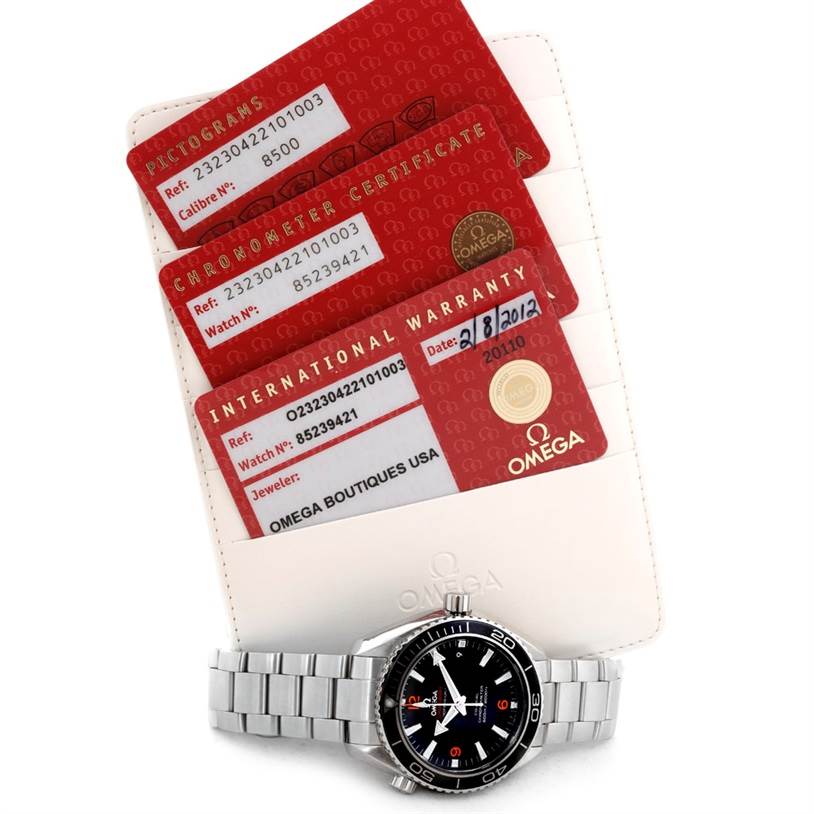 The image shows an Omega Planet Ocean 232.30.42.21.01.003 Men's Stainless Steel Black Dial 232.30.42.21.01.003 Men's Stainless Steel Black Dial watch, along with its pictogram, chronometer certificate, and international warranty card.