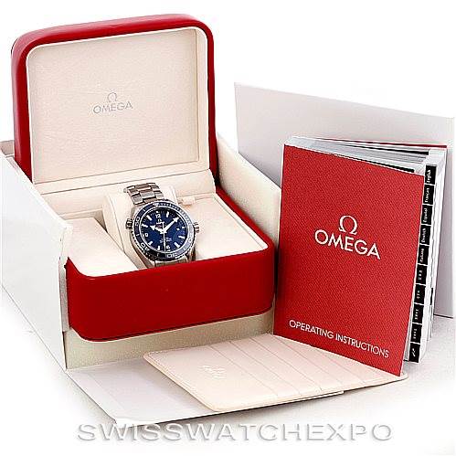 The image shows an Omega Planet Ocean 232.90.46.21.03.001 Men's Titanium Blue Dial 232.90.46.21.03.001 Men's Titanium Blue Dial watch in a red box with operating instructions and other accessories.