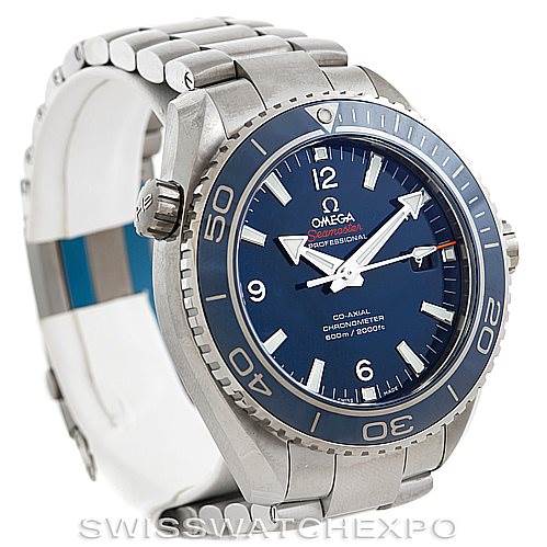 This image shows an Omega Planet Ocean 232.90.46.21.03.001 Men's Titanium Blue Dial 232.90.46.21.03.001 Men's Titanium Blue Dial watch at an angled side view, highlighting its blue dial, bezel, and stainless steel bracelet.