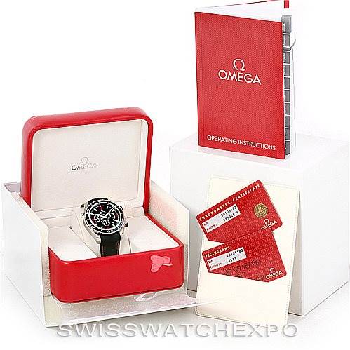The image shows an Omega Planet Ocean 2910.51.82 Men
s Stainless Steel Black Dial 2910.51.82 Men
s Stainless Steel Black Dial watch in its open box, with the operating instructions booklet and warranty cards placed nearby.