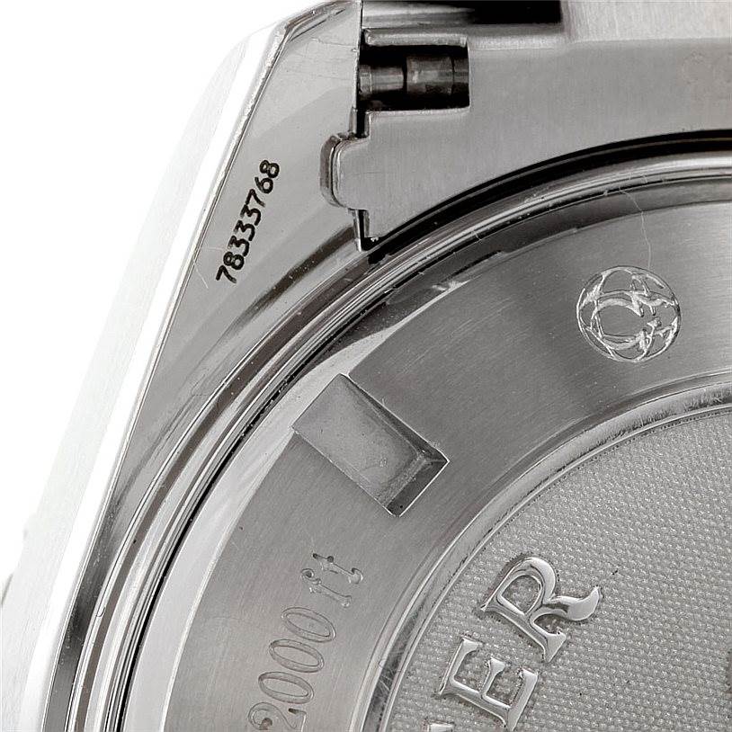 The image shows part of the case back and serial number of the Omega Planet Ocean 2210.50.00 Men's Stainless Steel Black Dial 2210.50.00 Men's Stainless Steel Black Dial watch from an angled close-up view.