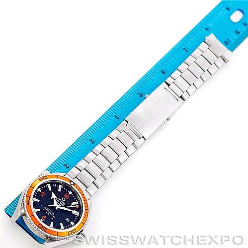 The Omega Planet Ocean 2209.50.00 Men
s Stainless Steel Black Dial 2209.50.00 Men
s Stainless Steel Black Dial watch is shown at a top-down angle with its full length beside a blue ruler.