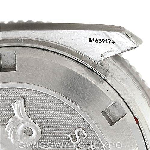 The image shows a close-up of the Omega Planet Ocean 2209.50.00 Men
s Stainless Steel Black Dial 2209.50.00 Men
s Stainless Steel Black Dial watch case back and part of the bezel with the serial number visible.