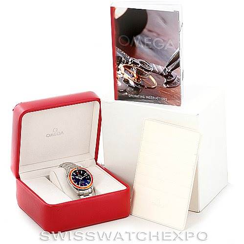 The image shows an Omega Planet Ocean 2209.50.00 Men
s Stainless Steel Black Dial 2209.50.00 Men
s Stainless Steel Black Dial watch in its red case, accompanied by an operating instructions manual and additional paperwork.