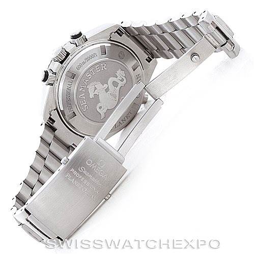 The image shows the Omega Planet Ocean 2210.51.00 Men
s Stainless Steel Black Dial 2210.51.00 Men
s Stainless Steel Black Dial watch from the back with an open stainless steel bracelet clasp.