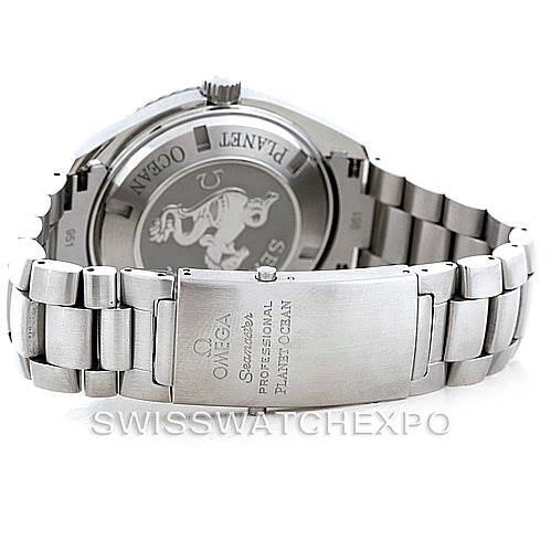 The image shows the back view of an Omega Planet Ocean 2208.50.00 Men
s Stainless Steel Black Dial 2208.50.00 Men
s Stainless Steel Black Dial watch, including the clasp and case back with engravings.