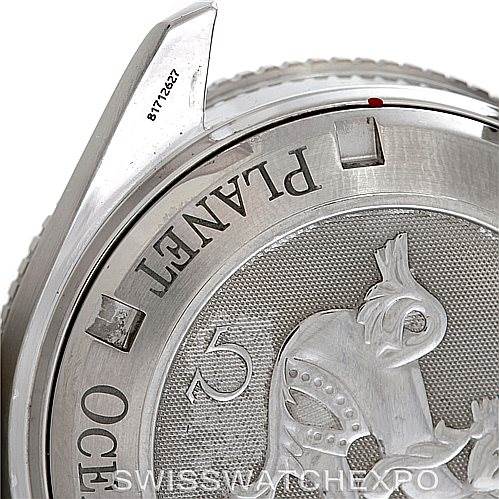 The image shows the back casing and part of the bezel of an Omega Planet Ocean 2201.51.00 Men's Stainless Steel Black Dial 2201.51.00 Men's Stainless Steel Black Dial watch.