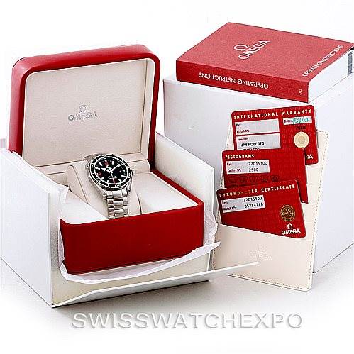 The image shows an Omega Planet Ocean 2201.51.00 Men's Stainless Steel Black Dial 2201.51.00 Men's Stainless Steel Black Dial watch with its box, warranty cards, and operating instructions from a front angle.