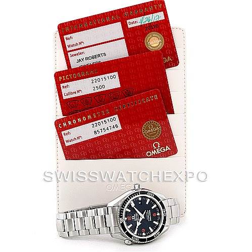 The image shows an Omega Planet Ocean 2201.51.00 Men's Stainless Steel Black Dial 2201.51.00 Men's Stainless Steel Black Dial watch, displayed face-up alongside its international warranty, pictogram, and chronometer certificate cards.