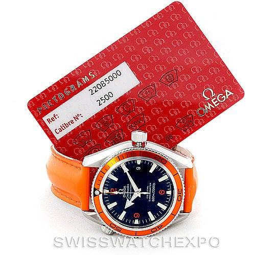 The image shows an Omega Planet Ocean 2909.50.83 Men's Stainless Steel Black Dial 2909.50.83 Men's Stainless Steel Black Dial watch, angled from the front, with an orange strap and the accompanying red identification card.