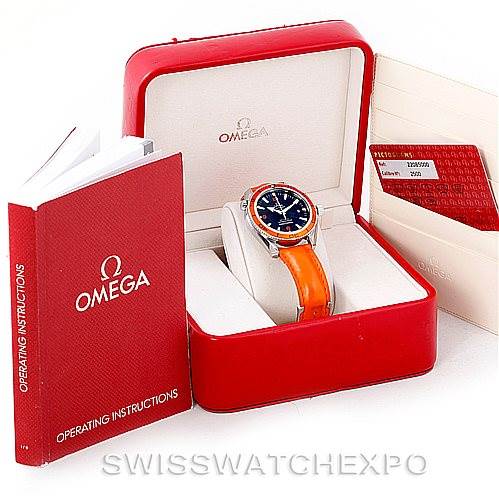 This image shows an Omega Planet Ocean 2909.50.83 Men's Stainless Steel Black Dial 2909.50.83 Men's Stainless Steel Black Dial watch in a red case with operating instructions and a warranty card on the side.