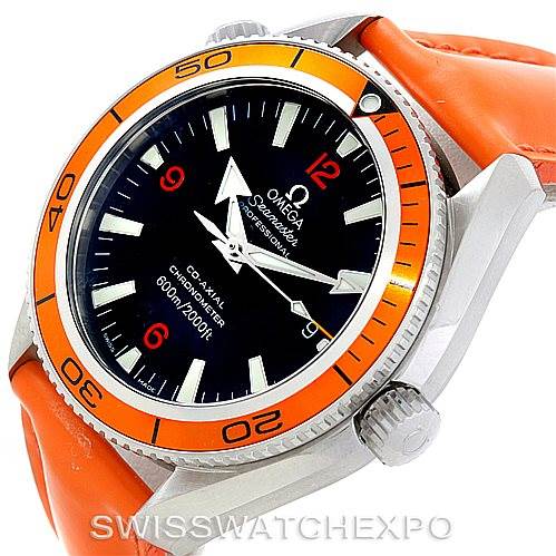 This image shows a close-up, angled view of the Omega Planet Ocean 2909.50.83 Men's Stainless Steel Black Dial 2909.50.83 Men's Stainless Steel Black Dial watch, highlighting its bezel, dial, hands, and orange strap.