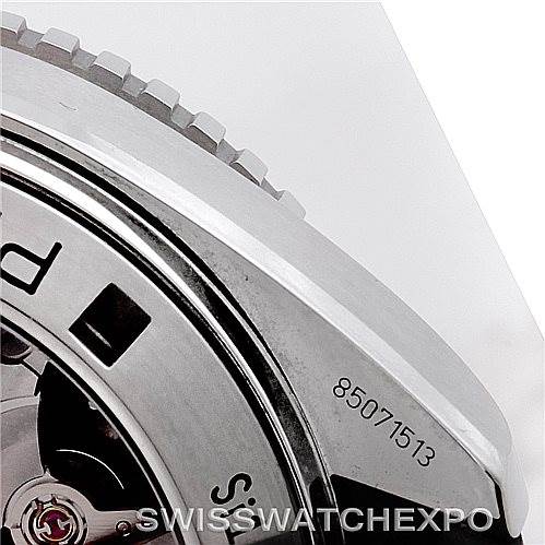 The image shows a close-up angled view of the side and back of an Omega Planet Ocean 232.32.46.51.01.003 Men
s Stainless Steel Black Dial 232.32.46.51.01.003 Men
s Stainless Steel Black Dial watch, highlighting the serial number and part of the mechanism.