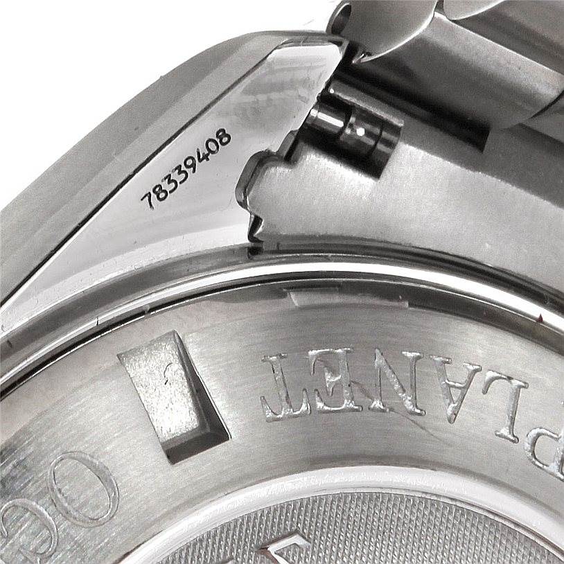 The image shows a close-up of the Omega Planet Ocean 2210.50.00 Men
s Stainless Steel Black Dial 2210.50.00 Men
s Stainless Steel Black Dial model watch, focusing on the serial number and part of the case back.