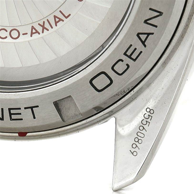 This close-up image shows the side of the Omega Planet Ocean 232.30.46.21.01.001 Men
s Stainless Steel Black Dial 232.30.46.21.01.001 Men
s Stainless Steel Black Dial model watch, highlighting the bezel and part of the case.
