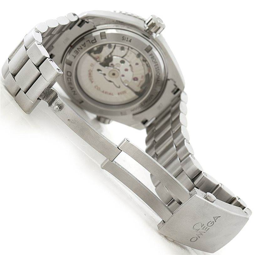 The image shows the Omega Planet Ocean 232.30.46.21.01.001 Men
s Stainless Steel Black Dial 232.30.46.21.01.001 Men
s Stainless Steel Black Dial watch
s open clasp and partially visible case back with a clear view of its mechanism.