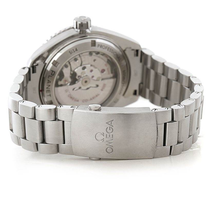 The image shows the Omega Planet Ocean 232.30.46.21.01.001 Men
s Stainless Steel Black Dial 232.30.46.21.01.001 Men
s Stainless Steel Black Dial
s case back, exposing the movement, and the stainless steel bracelet with the Omega logo on the clasp.