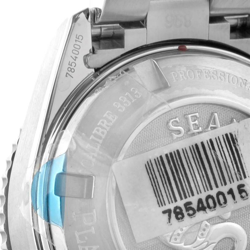 This image shows the back case of the Omega Planet Ocean 222.30.38.50.01.001 Stainless Steel Black Dial 222.30.38.50.01.001 Stainless Steel Black Dial watch, highlighting the serial number, movement details, and a barcode sticker.