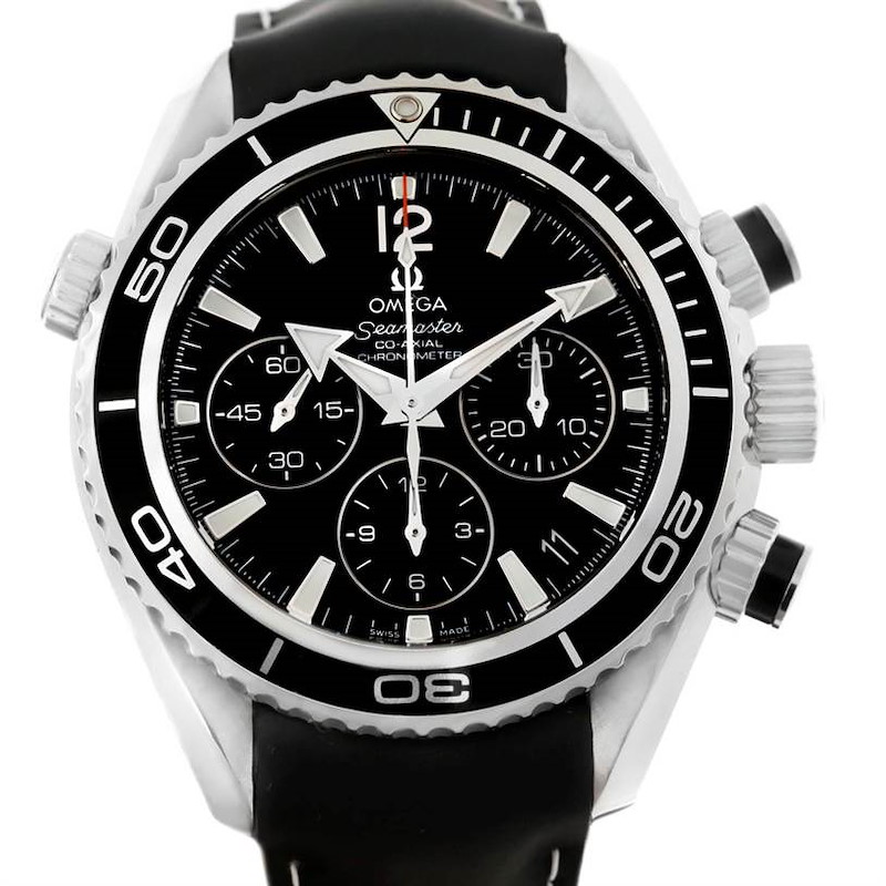 The image shows a front view of the Omega Planet Ocean watch, highlighting its black dial, bezel, chronograph subdials, and crown guards.