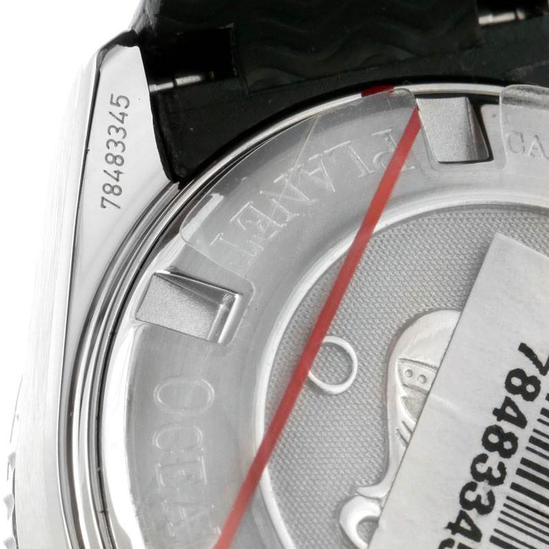 This image shows a close-up of the case back and part of the strap of an Omega Planet Ocean 222.32.38.50.01.001 Stainless Steel Black Dial 222.32.38.50.01.001 Stainless Steel Black Dial watch.