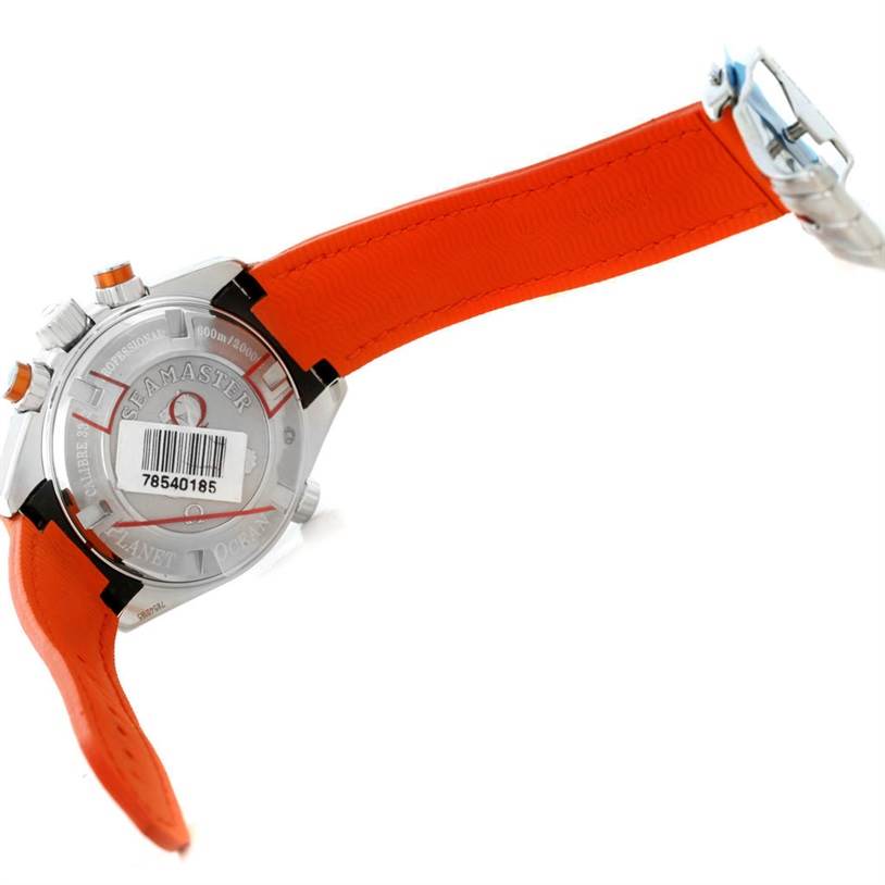 The image shows the back of the Omega Planet Ocean 222.32.38.50.01.003 Stainless Steel Black Dial 222.32.38.50.01.003 Stainless Steel Black Dial model watch, featuring an orange strap and visible branding details.