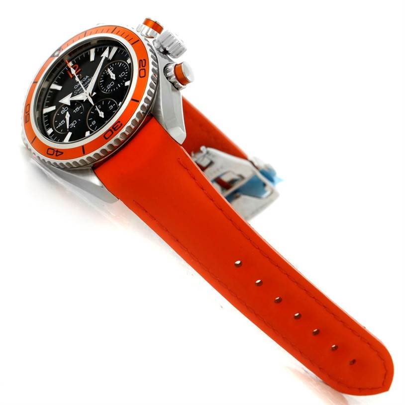 The Omega Planet Ocean 222.32.38.50.01.003 Stainless Steel Black Dial 222.32.38.50.01.003 Stainless Steel Black Dial watch is shown at an angle, highlighting the orange strap, orange bezel, crown, and side pushers.