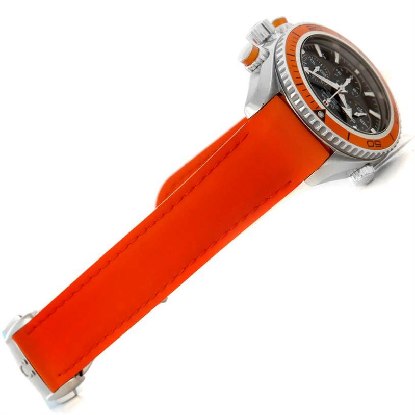 The image shows a side view of an Omega Planet Ocean 222.32.38.50.01.003 Stainless Steel Black Dial 222.32.38.50.01.003 Stainless Steel Black Dial watch with an orange strap and orange bezel.