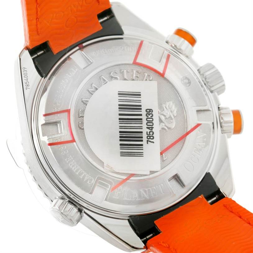 The image shows the back of the Omega Planet Ocean 222.32.38.50.01.003 Stainless Steel Black Dial 222.32.38.50.01.003 Stainless Steel Black Dial watch, including parts of the caseback, buttons, and an orange strap.