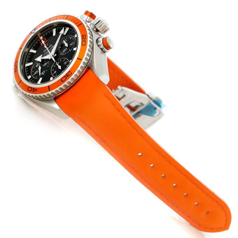 The image shows a side angle of an Omega Planet Ocean 222.32.38.50.01.003 Stainless Steel Black Dial 222.32.38.50.01.003 Stainless Steel Black Dial watch highlighting its orange bezel, crown, pushers, and orange strap.