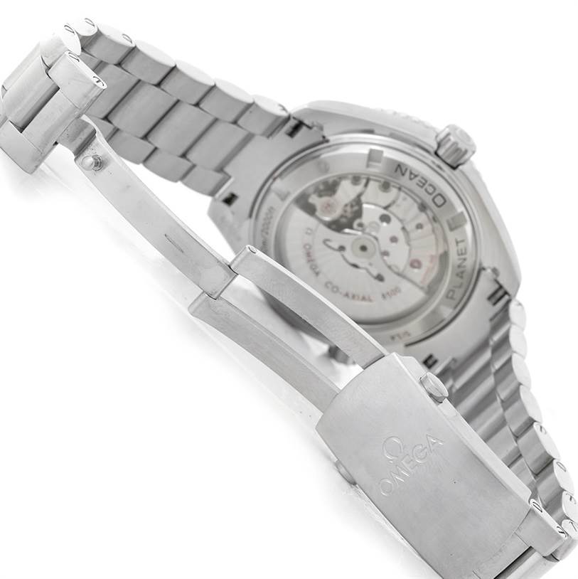 The image shows the back of the Omega Planet Ocean 232.30.42.21.01.003 Men
s Stainless Steel Black Dial 232.30.42.21.01.003 Men
s Stainless Steel Black Dial watch, focusing on the clasp and the transparent case back revealing the movement.