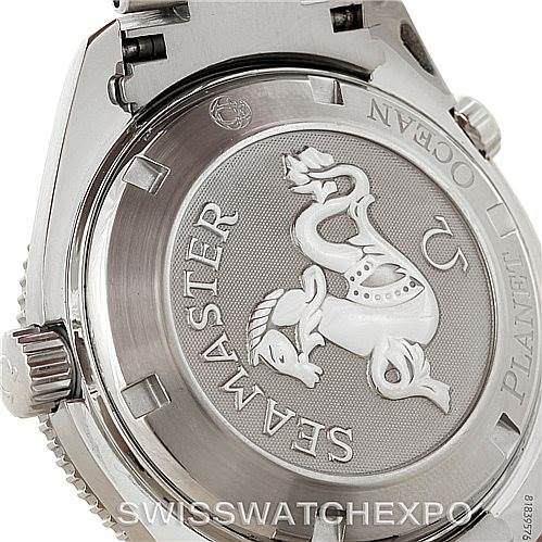 The image shows the case back of the Omega Seamaster Planet Ocean watch, highlighting the engraved seahorse design.