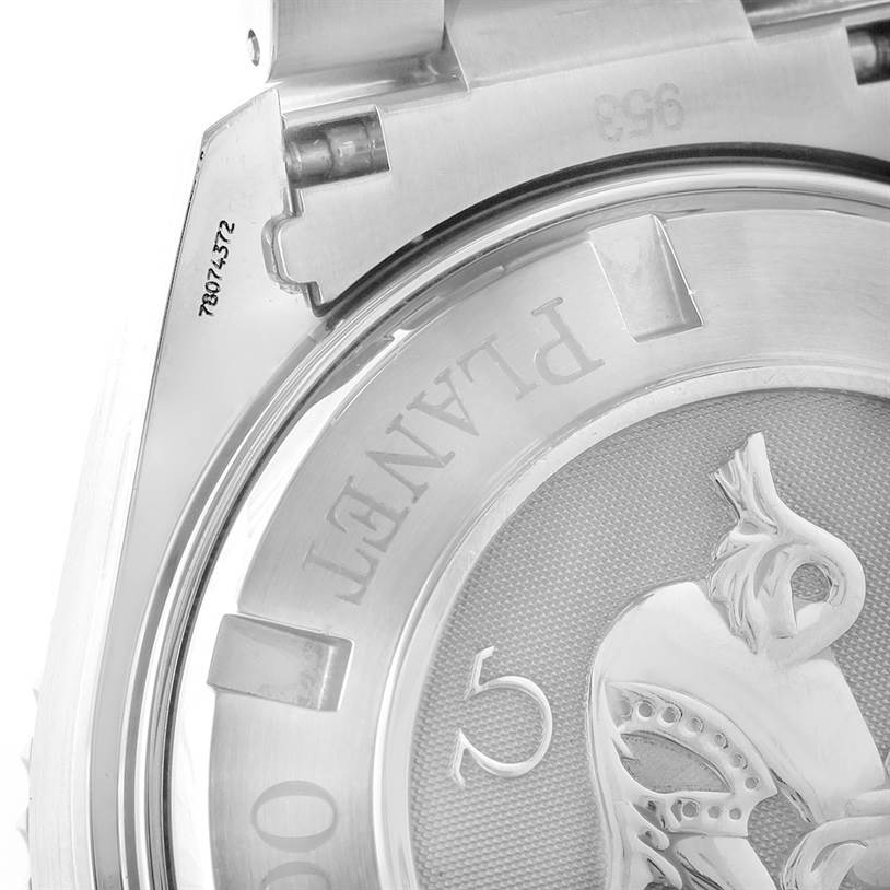 This image shows the back case of an Omega Planet Ocean 2210.50.00 Men
s Stainless Steel Black Dial 2210.50.00 Men
s Stainless Steel Black Dial watch, including the hinge and part of an engraved design.