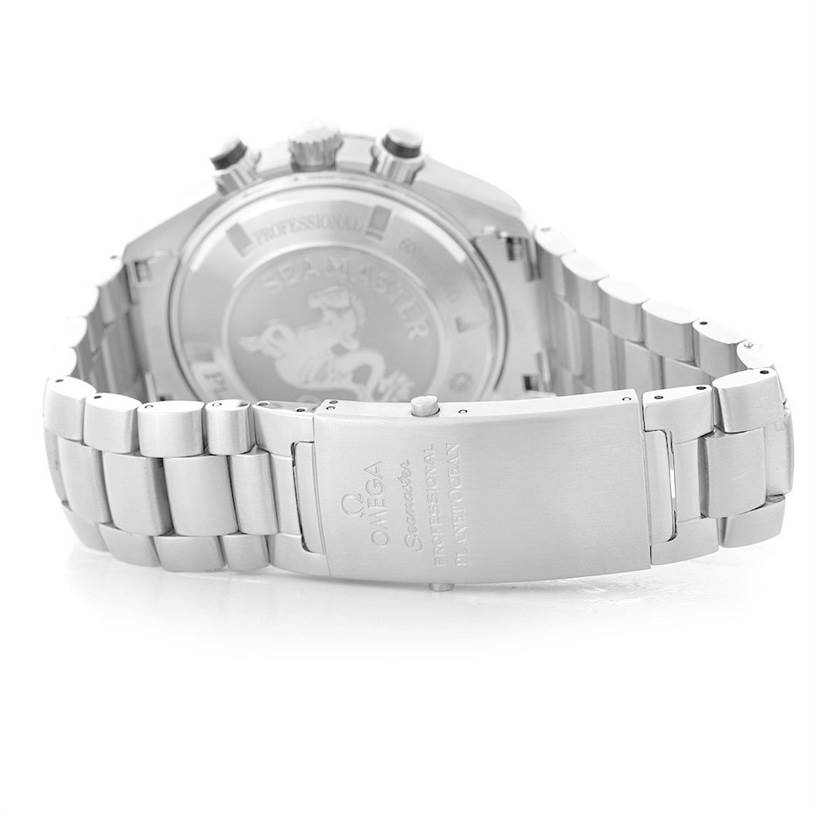 The image shows the rear view and clasp of the Omega Seamaster Planet Ocean watch, highlighting the engraved case back and metal bracelet.