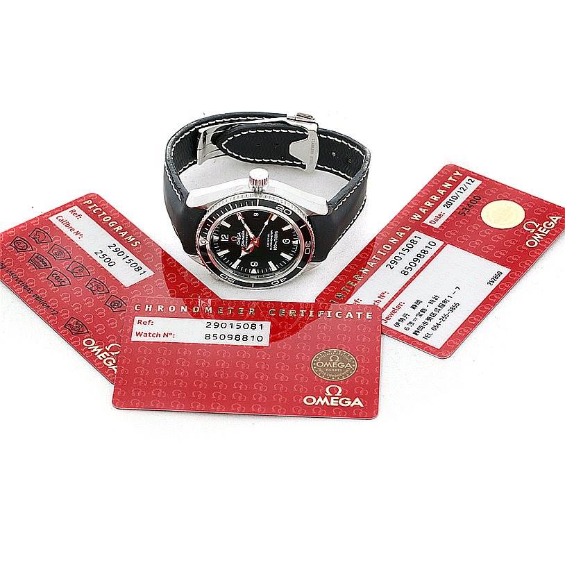 The image shows the Omega Planet Ocean 2901.50.81 Men
s Stainless Steel Black Dial 2901.50.81 Men
s Stainless Steel Black Dial watch viewed from the top, accompanied by Best Quality
ation and warranty cards.