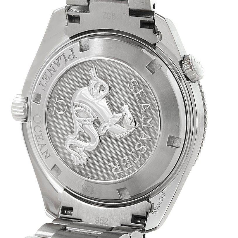 The image shows the case back of the Omega Planet Ocean 2209.50.00 Men
s Stainless Steel Black Dial 2209.50.00 Men
s Stainless Steel Black Dial Seamaster watch, highlighting the embossed seahorse logo and inscriptions.