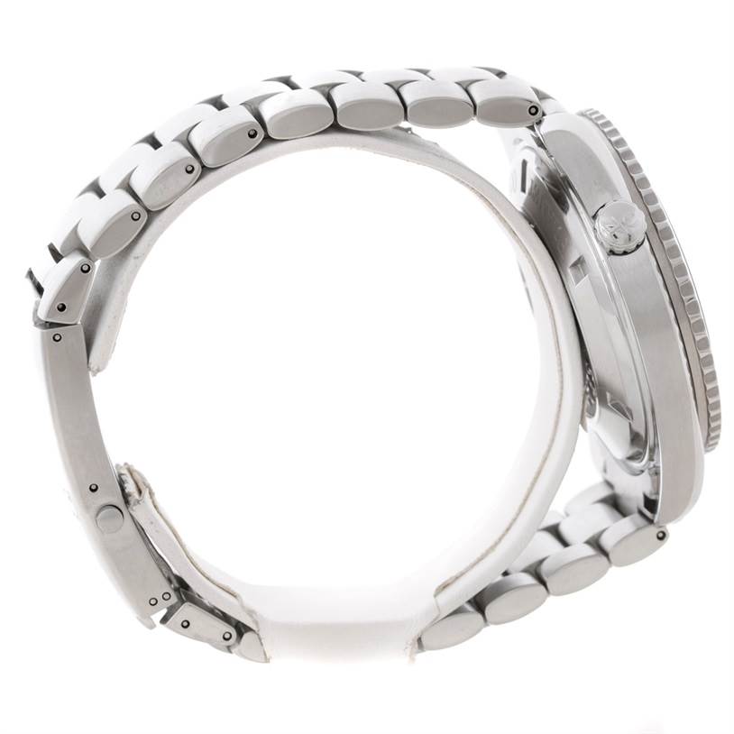 A side view of the Omega Planet Ocean 2200.51.00 Men
s Stainless Steel Black Dial 2200.51.00 Men
s Stainless Steel Black Dial watch showing the bracelet and the crown side of the case.