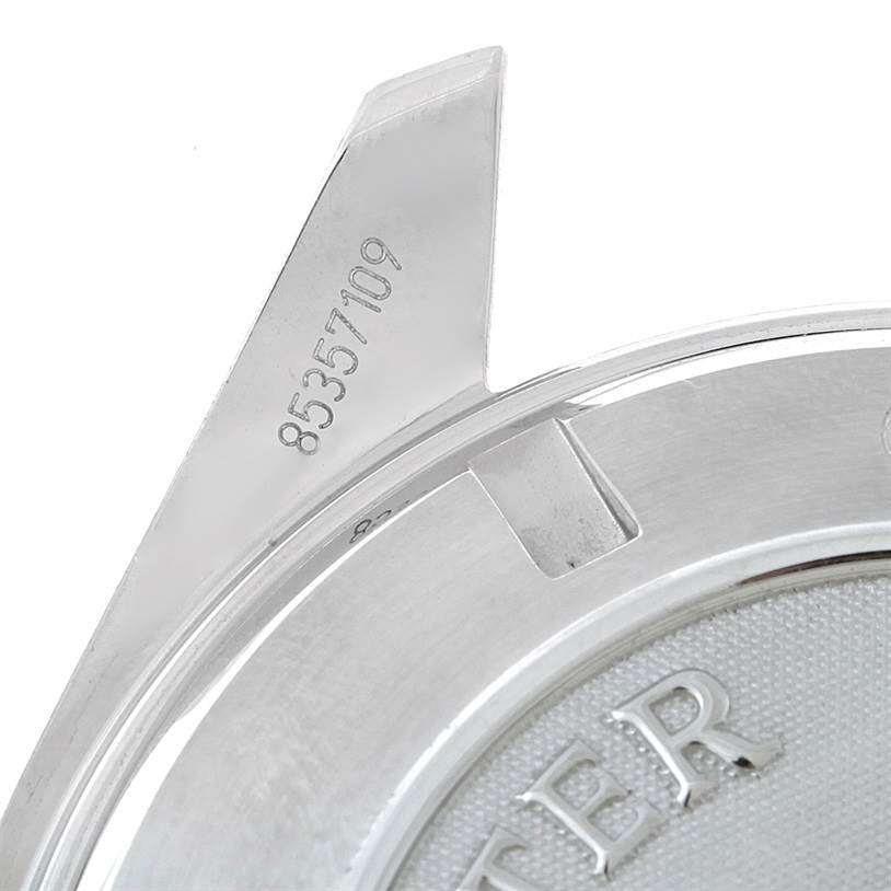 This image shows a close-up view of the serial number and part of the case back of an Omega Planet Ocean 2200.50.00 Men's Stainless Steel Black Dial 2200.50.00 Men's Stainless Steel Black Dial watch.