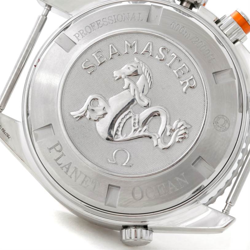 The image shows the back case of an Omega Seamaster Planet Ocean watch, highlighting the embossed seahorse logo and text detailing.