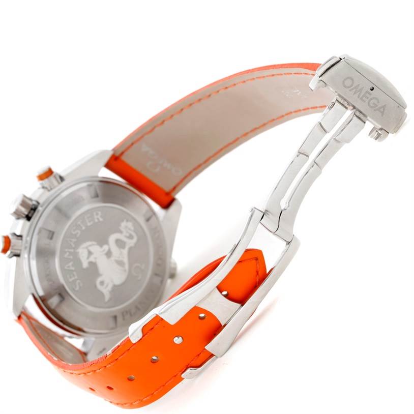 This Omega Planet Ocean 2918.50.83 Men's Stainless Steel Black Dial 2918.50.83 Men's Stainless Steel Black Dial watch is shown from the back, displaying its case back, orange leather strap, and clasp.