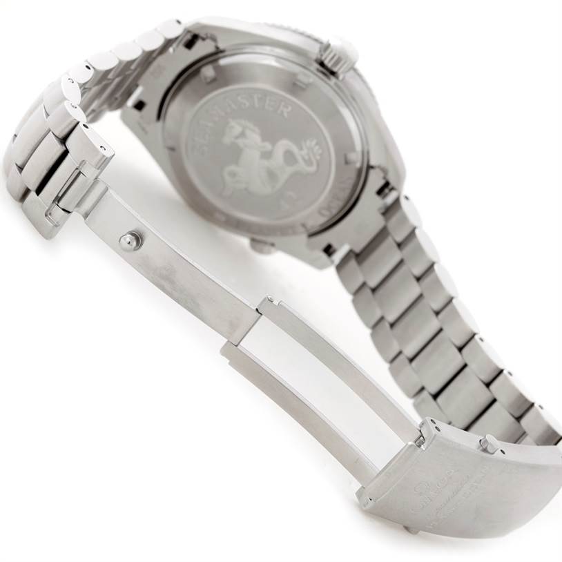 The image shows the rear view of the Omega Planet Ocean 2209.50.00 Men
s Stainless Steel Black Dial 2209.50.00 Men
s Stainless Steel Black Dial watch, focusing on the case back and partially opened bracelet clasp.