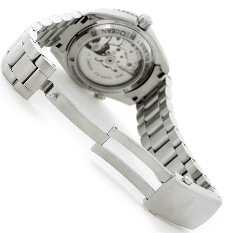 The image shows the rear view of the Omega Planet Ocean 232.30.42.21.01.003 Men's Stainless Steel Black Dial 232.30.42.21.01.003 Men's Stainless Steel Black Dial watch, focusing on its case back and metal bracelet with an open clasp.