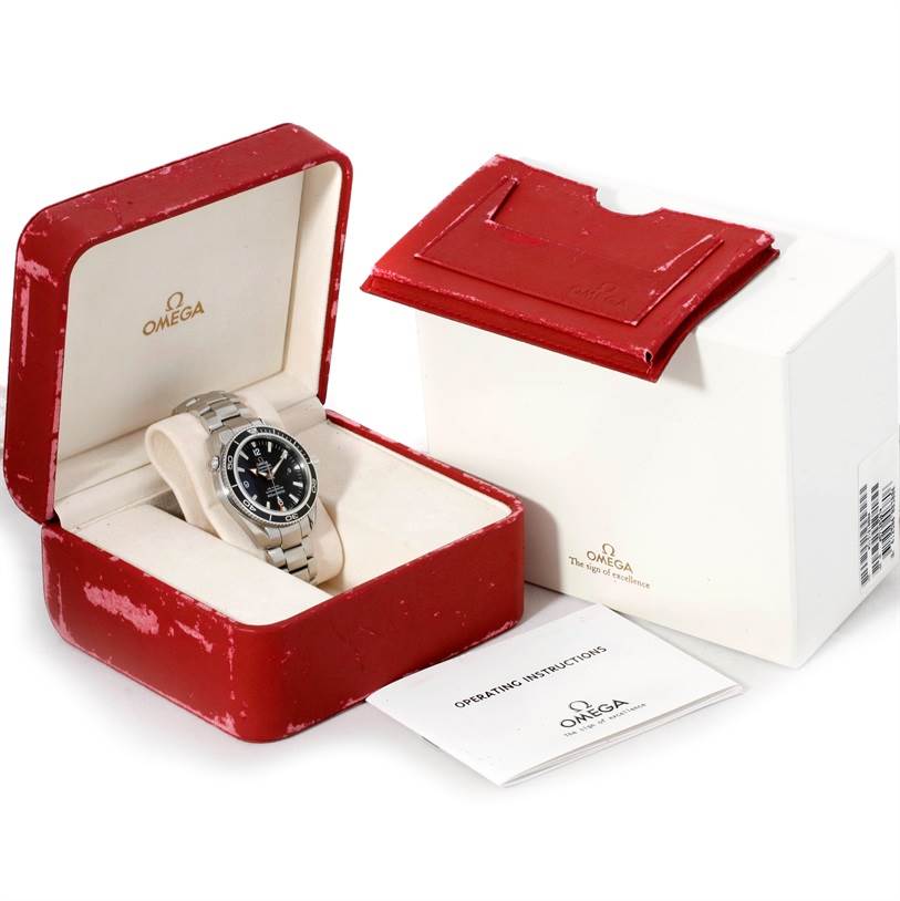 The Omega Planet Ocean 2201.50.00 Men
s Stainless Steel Black Dial 2201.50.00 Men
s Stainless Steel Black Dial watch is shown in its open red box with the outer white box and operating instructions booklet.