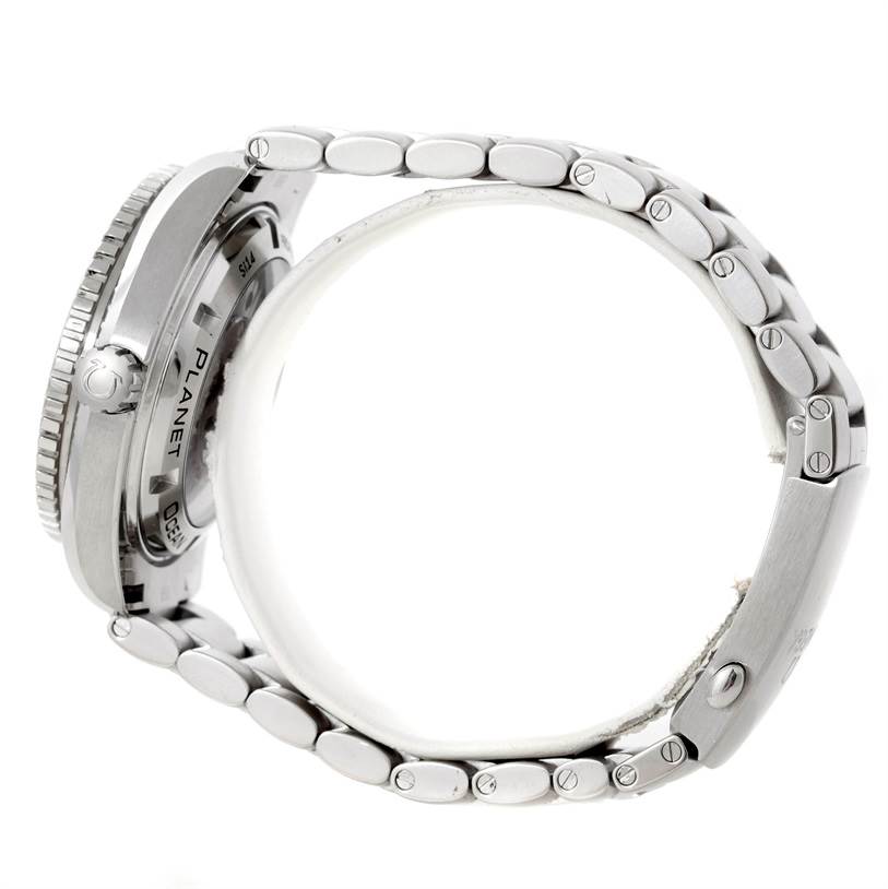 The image shows a side view of the Omega Planet Ocean 232.30.42.21.01.003 Men
s Stainless Steel Black Dial 232.30.42.21.01.003 Men
s Stainless Steel Black Dial watch, highlighting the case back and metallic bracelet.