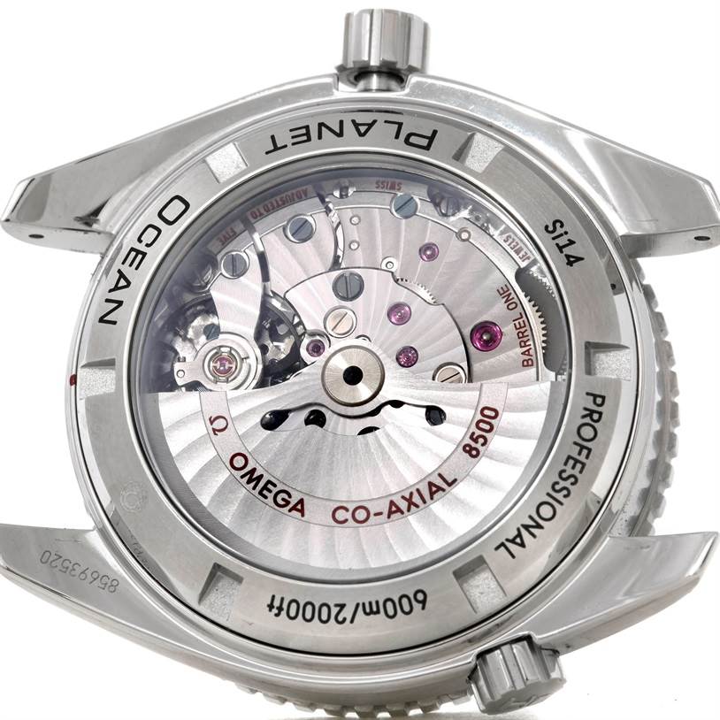 The image shows the back of an Omega Planet Ocean 232.30.42.21.01.003 Men
s Stainless Steel Black Dial 232.30.42.21.01.003 Men
s Stainless Steel Black Dial watch, highlighting its Co-Axial 8500 movement.