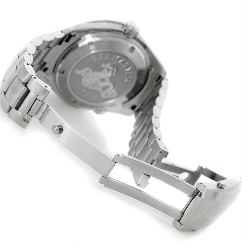 The image shows the backside and open clasp of an Omega Planet Ocean 2201.50.00 Men
s Stainless Steel Black Dial 2201.50.00 Men
s Stainless Steel Black Dial watch, highlighting the bracelet and engraved case back.