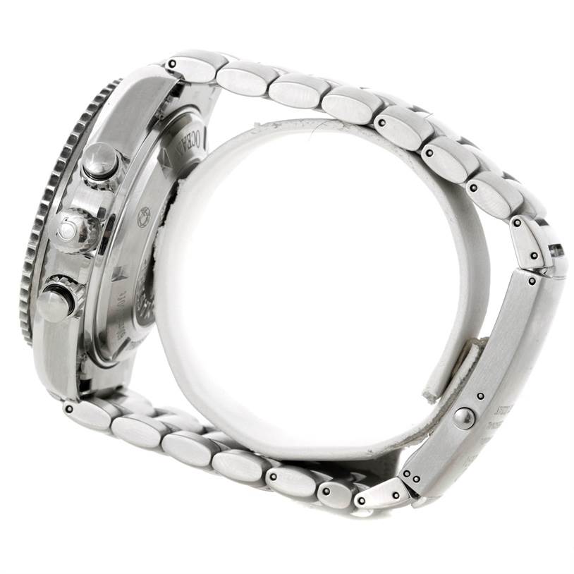 The image shows a side view of an Omega Planet Ocean 2210.51.00 Men's Stainless Steel Black Dial 2210.51.00 Men's Stainless Steel Black Dial watch, highlighting the bezel, crown, and part of the metal bracelet.