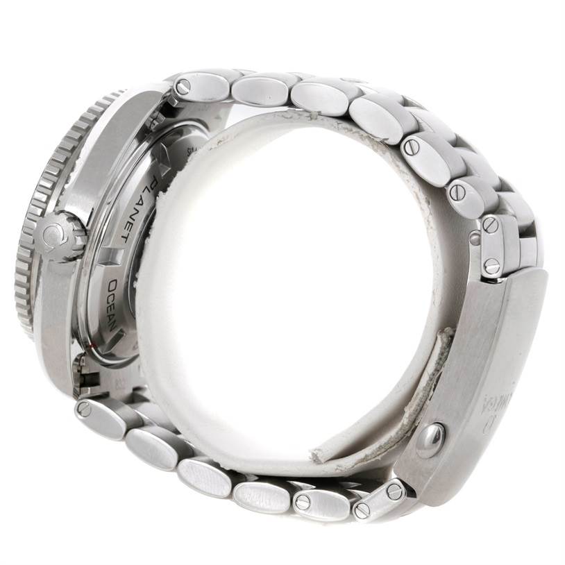 The image shows a side view of the Omega Planet Ocean 232.30.38.20.01.001 Men's Stainless Steel Black Dial 232.30.38.20.01.001 Men's Stainless Steel Black Dial watch, highlighting the crown, case, and metal bracelet.