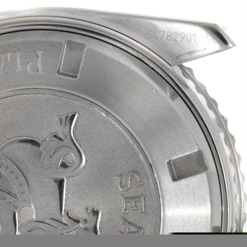 This image shows a close-up of the back case and part of the clasp of the Omega Planet Ocean 2200.50.00 Men's Stainless Steel Black Dial 2200.50.00 Men's Stainless Steel Black Dial watch.