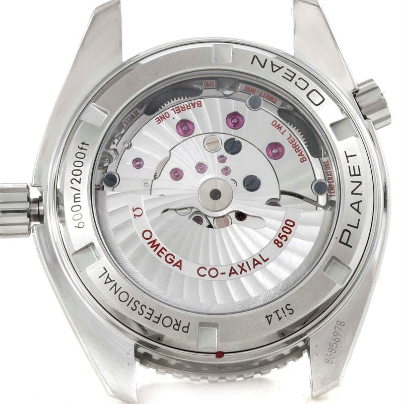 The image shows the back view of the Omega Planet Ocean 232.30.42.21.01.001 Men
s Stainless Steel Black Dial 232.30.42.21.01.001 Men
s Stainless Steel Black Dial watch, displaying its internal mechanism and inscriptions.