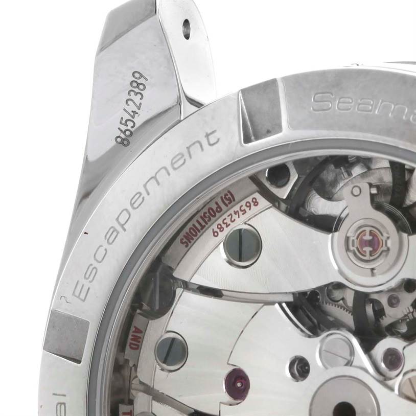 The image shows the back and internal mechanism of the Omega Aqua Terra 231.10.39.21.06.001 Men's Stainless Steel Grey Dial 231.10.39.21.06.001 Men's Stainless Steel Grey Dial watch at an angle, highlighting the escapement and serial number.